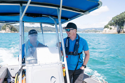 Chris Bredenbeck (right) and Barry King conduct a patrol aboard Kaimahi.