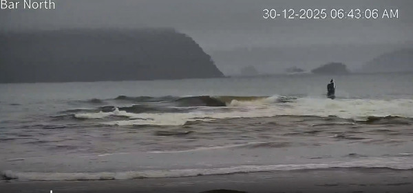 Still from the Tairua bar camera shows the 5.5 metre boat overturning